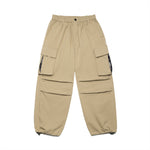 Men's oversized parachute cargo pants with flap pockets by Yeha Maison, featuring a relaxed fit and utilitarian design.