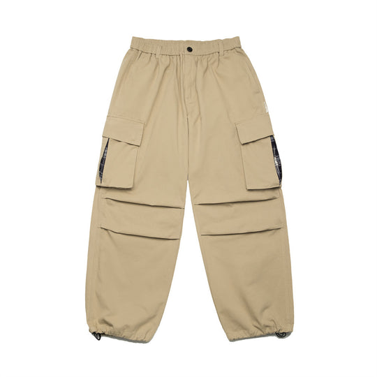 Men's oversized parachute cargo pants with flap pockets by Yeha Maison, featuring a relaxed fit and utilitarian design.