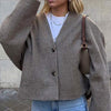 Women's collarless button-front short coat by Yeha Maison, featuring a sleek design and tailored fit in a stylish outerwear style.