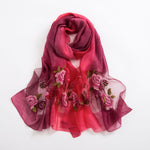 Yeha Maison Wild Embroidery Silk Scarf with intricate floral embroidery, showcasing luxurious silk fabric and vibrant design.