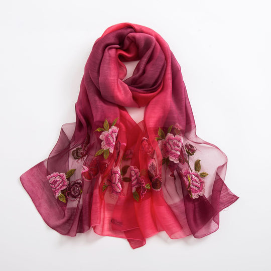 Yeha Maison Wild Embroidery Silk Scarf with intricate floral embroidery, showcasing luxurious silk fabric and vibrant design.