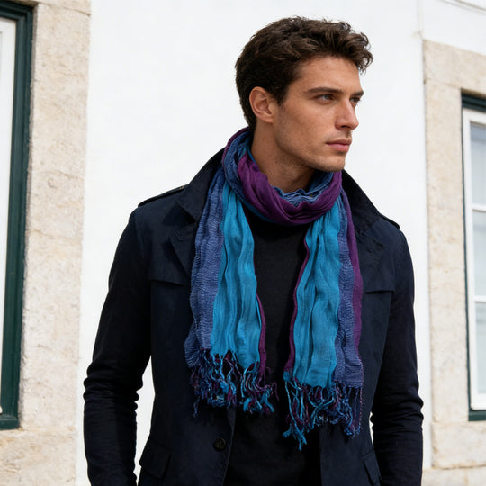 Sky blue crinkle dyed long scarf from Yeha Maison, showing its lightweight, textured fabric and elegant drape.