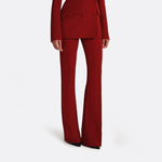 Women's double-breasted power blazer and flared trouser suit by Yeha Maison, shown on a model.