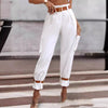 Women's tapered cargo trousers with belt from Yeha Maison, featuring a relaxed fit and functional pockets.