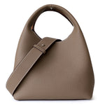 Color block cowhide bucket bag for women by Yeha Maison, featuring mixed vibrant leather panels and a stylish, rounded shape.