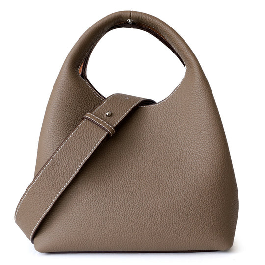 Color block cowhide bucket bag for women by Yeha Maison, featuring mixed vibrant leather panels and a stylish, rounded shape.