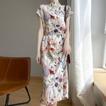 Women's botanical print silk midi dress with Mandarin collar by Yeha Maison, showcasing elegant floral design and flowing fabric.