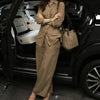 Women's khaki linen co-ords from Yeha Maison featuring an oversized shirt and wide-leg trousers, styled casually on a model.