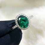S925 sterling silver diamond oval halo ring with intricate detailing, showcasing a sparkling central gemstone and elegant design.