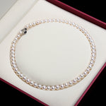 Elegant white pearl necklace by Yeha Maison featuring smooth, round pearls on a delicate jewelry chain.