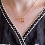 Women's V Gold Snake Chain Statement Necklace by Yeha Maison, showcasing a sleek gold jewelry piece with a V-shaped design.