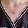 Women's V Gold Snake Chain Statement Necklace by Yeha Maison, showcasing a sleek gold jewelry piece with a V-shaped design.