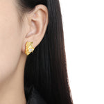 Women's geometric asymmetric diamond stud earrings by Yeha Maison featuring modern, stylish jewelry design with sparkling diamonds.