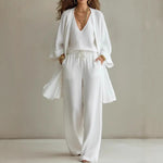 Women's white V-neck open cardigan and wide-leg trouser co-ord set by Yeha Maison, featuring a stylish three-piece outfit.