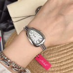 Yeha Maison snake head tassel chain women's quartz watch with elegant design and detailed snake head motif.