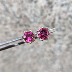 Pink Topaz sterling silver stud earrings plated with 18K white gold, featuring a delicate and elegant jewelry design.