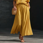 Women's linen-look V-neck button top and A-line maxi skirt set by Yeha Maison, casual and stylish outfit for warm weather.