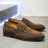 Men's suede penny loafer shoes by Yeha Maison, close-up of classic brown slip-on footwear with stitching details.