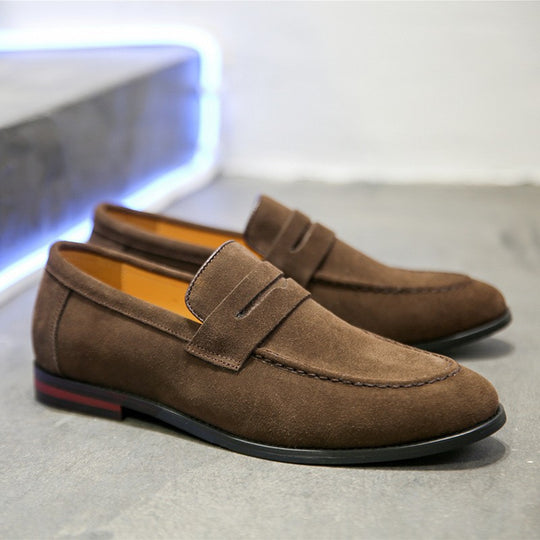 Men's suede penny loafer shoes by Yeha Maison, close-up of classic brown slip-on footwear with stitching details.