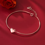 Simple glossy silver and gold bracelet from Yeha Maison, featuring sleek, shiny jewelry design on a white background.