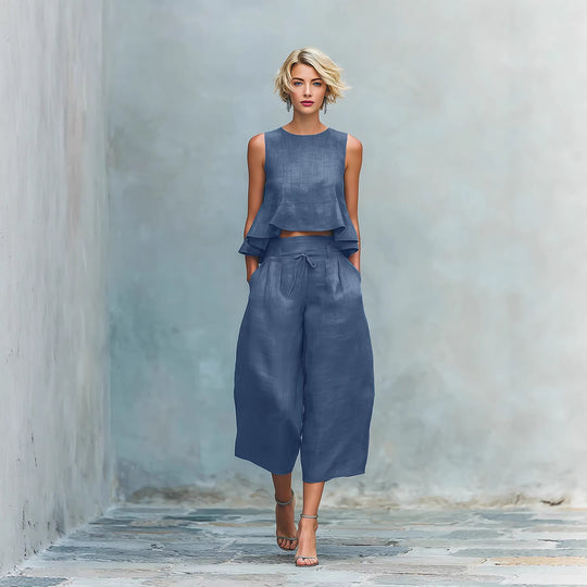 Yeha Maison women's peplum ruffle sleeveless top and wide-leg trouser co-ords set, shown in a stylish, coordinated outfit.