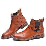 Men's leather ankle boots with harness detail from Yeha Maison, featuring a stylish leather design and sturdy sole.