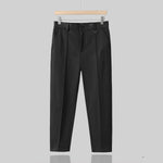 Men's wool blend tapered suit trousers by Yeha Maison, showing the dark tailored pants with a flat front and slim fit.