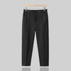 Men's wool blend tapered suit trousers by Yeha Maison, showing the dark tailored pants with a flat front and slim fit.