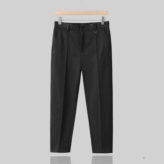 Men's wool blend tapered suit trousers by Yeha Maison, showing the dark tailored pants with a flat front and slim fit.