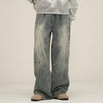 Men's deconstructed wide-leg jeans by Yeha Maison, featuring arc-seam detailing and a relaxed fit, shown in a natural denim wash.