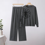 Women’s floral embroidery oversized knit top and wide-leg trouser set by Yeha Maison, featuring colorful floral details and relaxed fit.