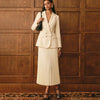 Women's double-breasted blazer and pleated midi skirt suit by Yeha Maison, shown on a model, stylish and professional attire.