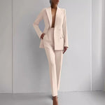 Women's double-breasted slim blazer and tapered trousers suit by Yeha Maison, shown on a mannequin with classic tailoring.