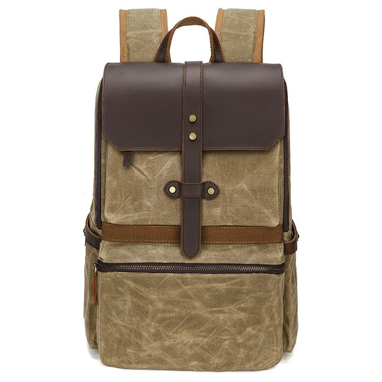 Waxed canvas and leather flap backpack by Yeha Maison, showing durable material, front flap, adjustable straps, and classic bag design.