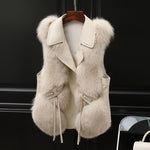 Women's faux fox fur vest by Yeha Maison with notch lapel and belt, showcasing plush fur and stylish design.