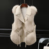 Women's faux fox fur vest by Yeha Maison with notch lapel and belt, showcasing plush fur and stylish design.
