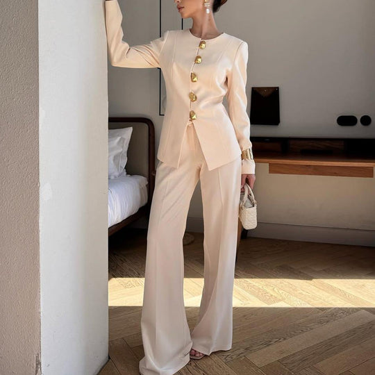 Women's gold button asymmetric blazer and wide-leg trousers set by Yeha Maison, stylish tailored suit with modern design.