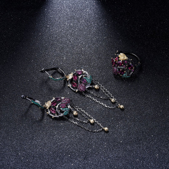 Yeha Maison Secret Garden gemstone ring featuring intricate floral design and vibrant gemstones in a delicate jewelry piece.