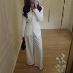 Women's structured V-neck blazer and wide-leg pant suit by Yeha Maison, featuring tailored fit and classic style in neutral fabric