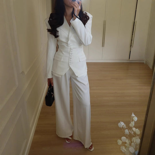 Women's structured V-neck blazer and wide-leg pant suit by Yeha Maison, featuring tailored fit and classic style in neutral fabric