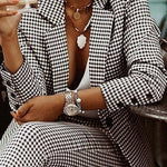 Women's houndstooth blazer and trouser suit set by Yeha Maison, featuring a tailored lapel and classic pattern, perfect for professional wear.