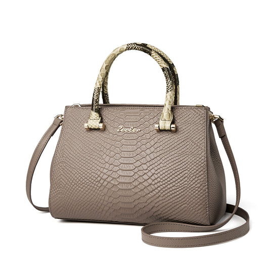 Women's first-layer cowhide leather handbag by Yeha Maison, featuring a sleek design and natural leather texture.