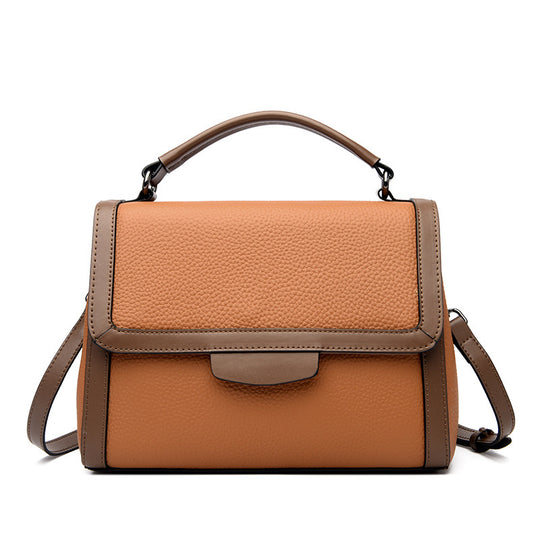 Women's soft leather textured crossbody handbag in natural brown with adjustable strap and subtle brand logo detail.