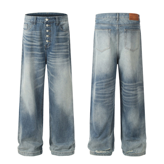 Men's light wash wide-leg jeans by Yeha Maison with button fly and relaxed fit, shown hanging on a wooden background.