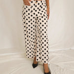 Women's high-waist polka-dot wide-leg trousers by Yeha Maison, featuring a stylish and comfortable fit with a classic polka-dot pattern.