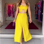Women's ruffled crop top and slit skirt set by Yeha Maison, featuring a stylish two-piece design with feminine ruffles and a slit detail.