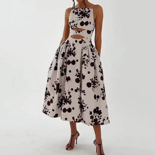 Women's floral cut-out spaghetti-strap midi dress by Yeha Maison displayed with a flowy, feminine design and vibrant floral pattern.