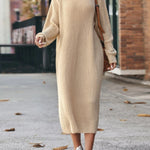 Yeha Maison chunky ribbed turtleneck midi sweater dress hanging on a rack, showcasing its cozy knit texture and classic silhouette.