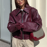 Women's black zip-front lapel leather jacket by Yeha Maison, stylish outerwear with a sleek design and classic fit.