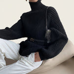 Women’s oversized turtleneck cable-knit sweater by Yeha Maison, featuring chunky knit pattern and relaxed fit in neutral tones.